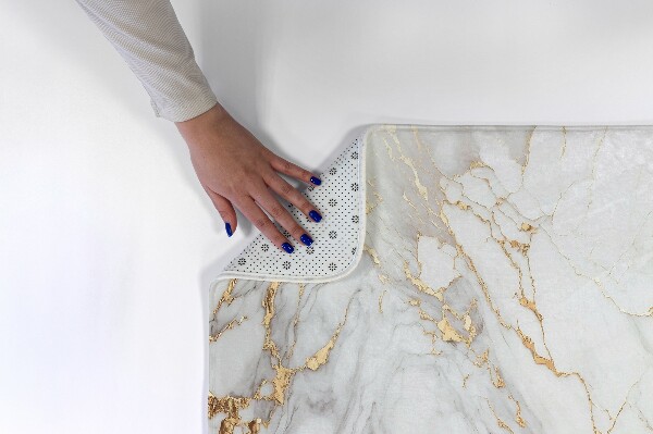 Tapis Motif de marbre dans les tons de beige.