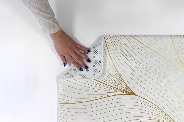 Tapis Lignes ondulées dorées sur fond blanc