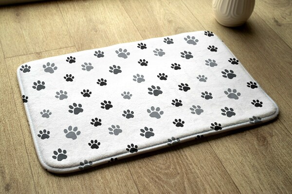 Tapis Empreintes de pattes sur fond blanc