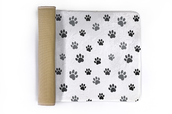 Tapis Empreintes de pattes sur fond blanc