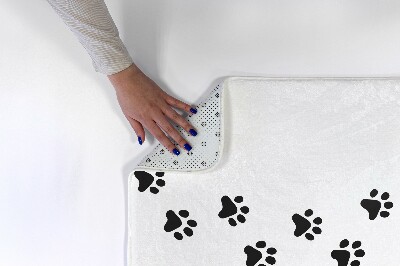 Tapis Empreintes de pas sur fond blanc