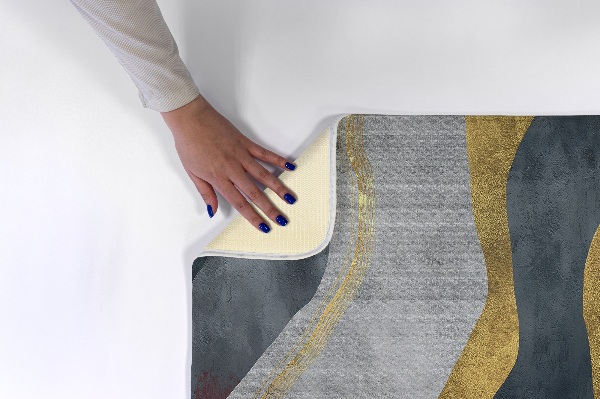 Tapis Lignes ondulées abstraites dans des tons dorés