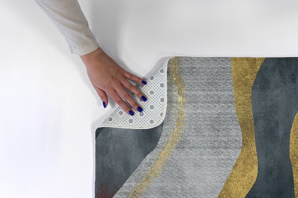 Tapis Lignes ondulées abstraites dans des tons dorés